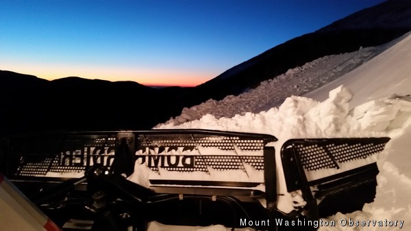 Sunrise over the snowcat blade